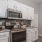 a kitchen with white cabinets