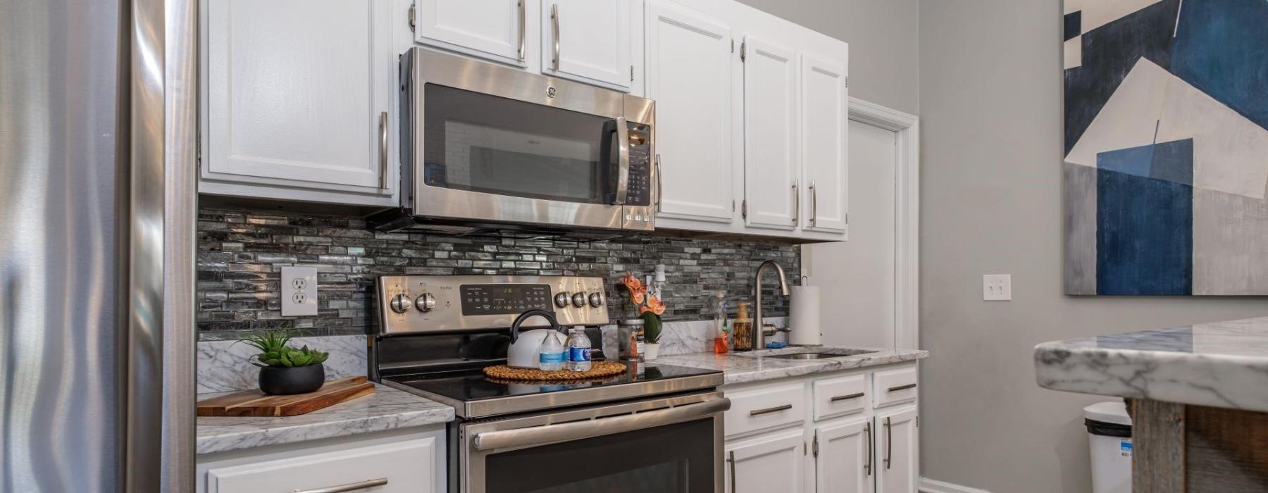 a kitchen with white cabinets