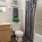 a bathroom with a tub, toilet, and sink