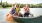 a group of people in a canoe