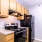 a kitchen with wooden cabinets