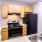 a kitchen with wooden cabinets