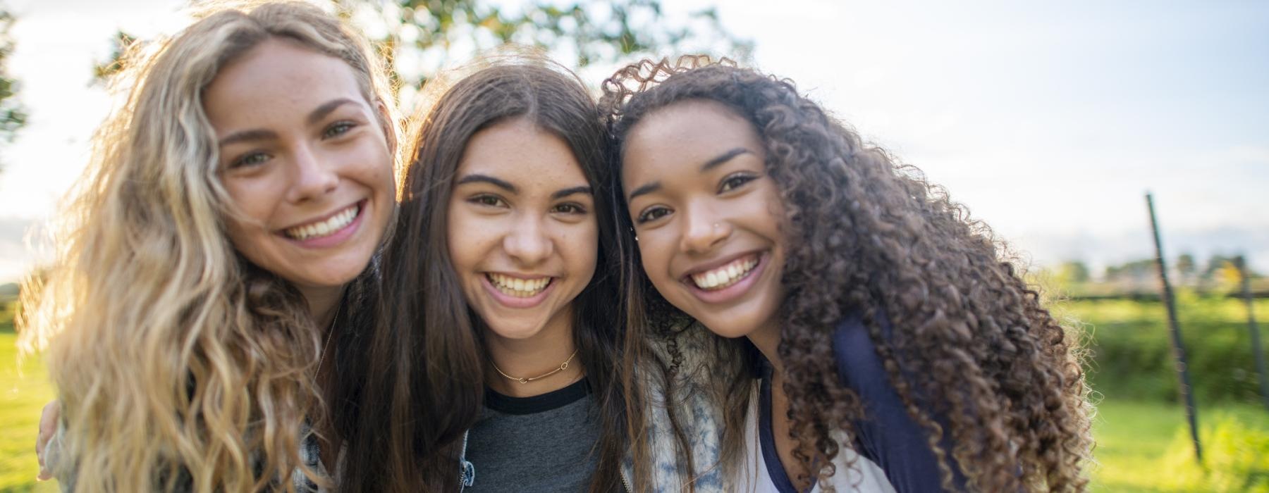 a group of women smiling
